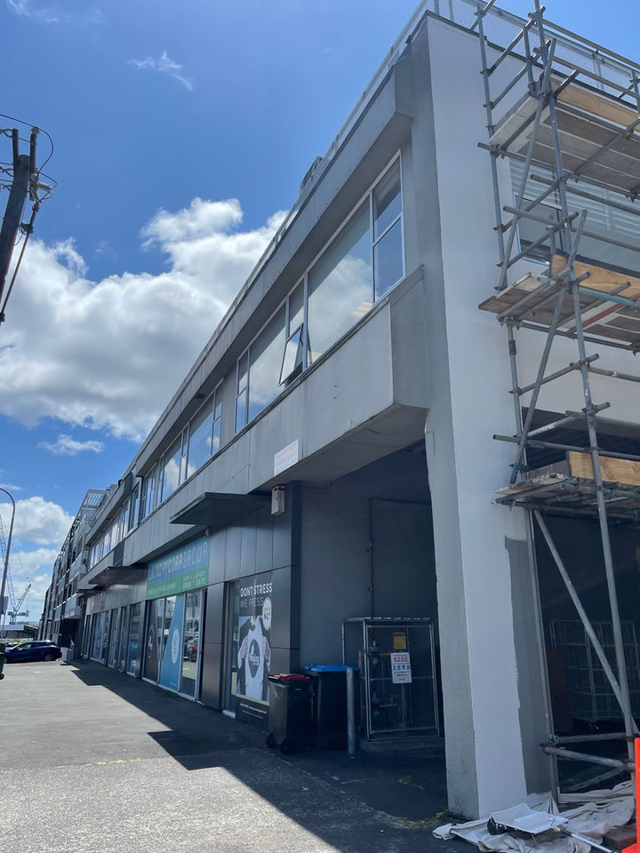 Multi-unit building exterior with scaffolding